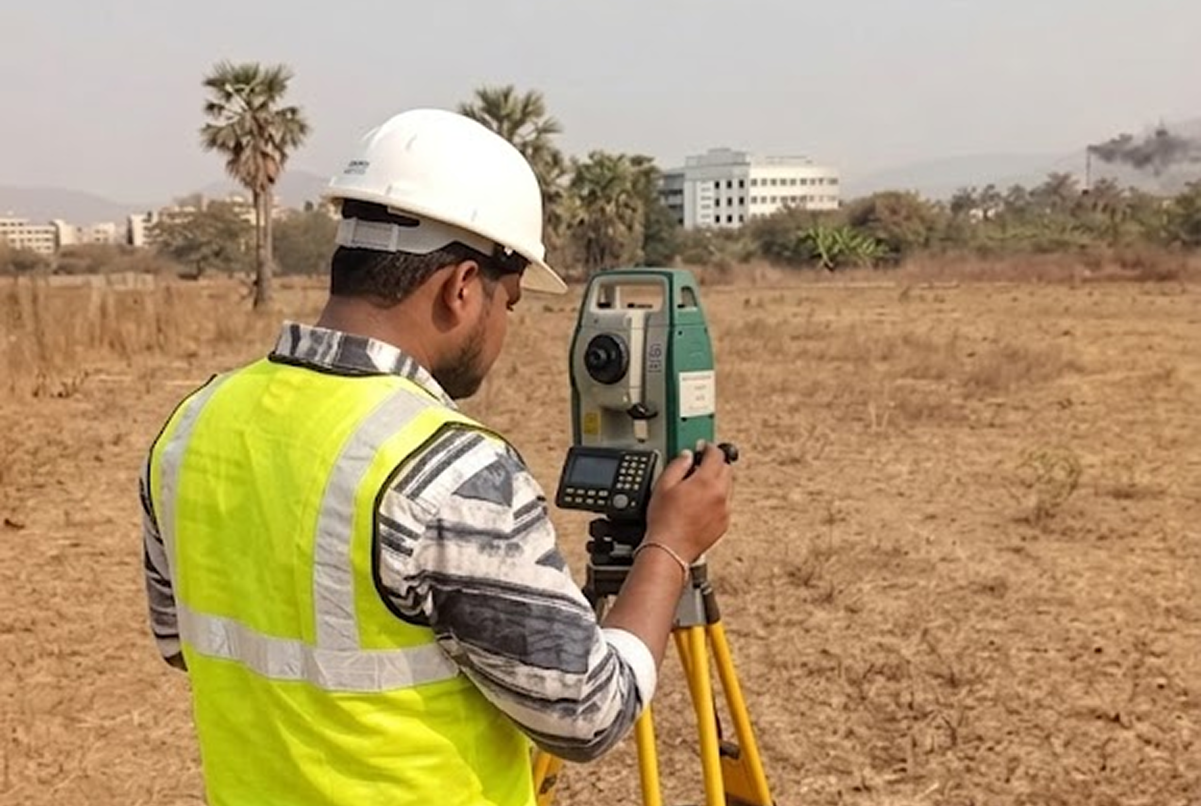Topographic survey in progress — Sokkia Total Station measuring land contours in Thane district